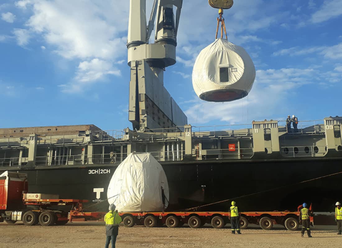 wind turbine parts being loaded on a truck.jpg